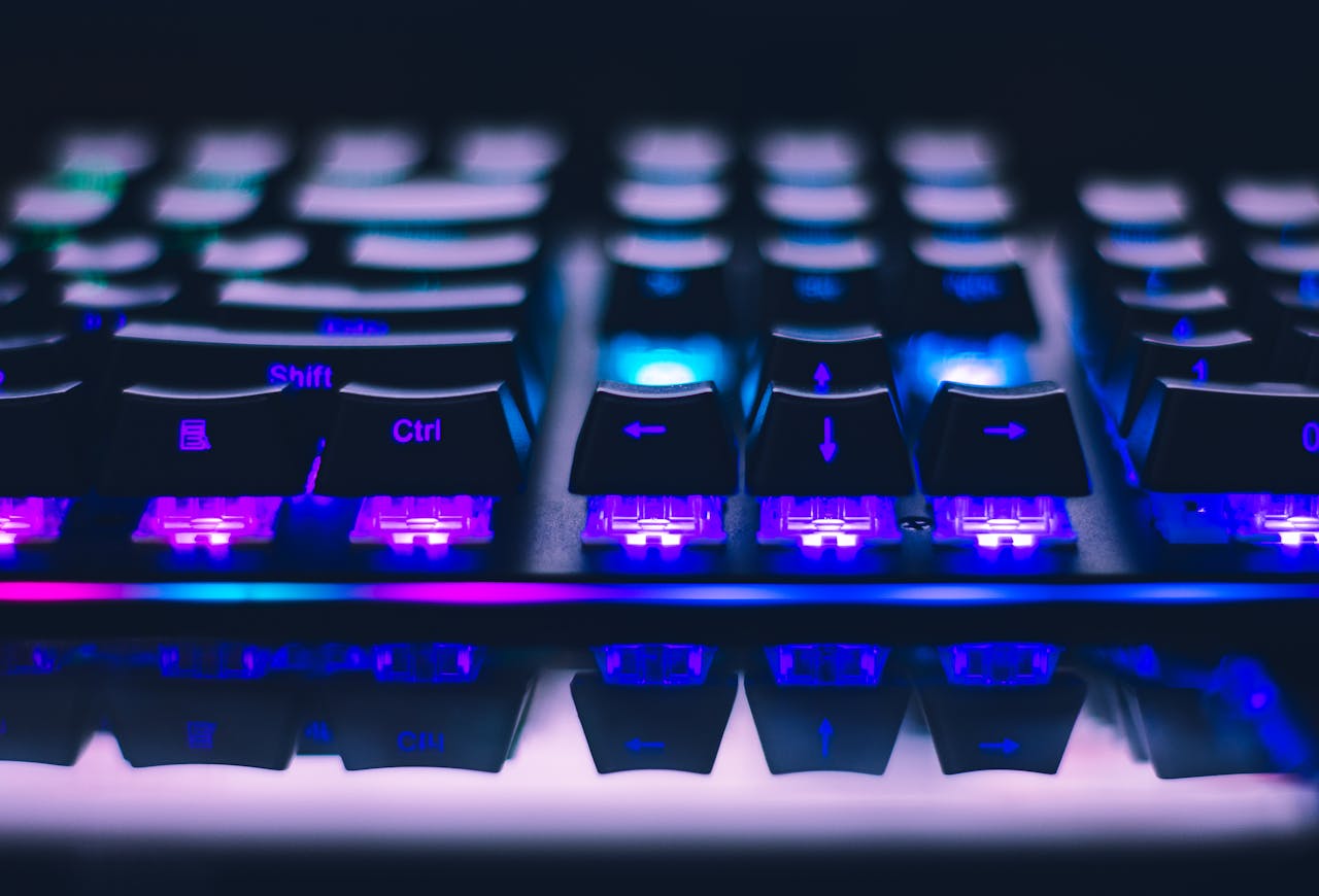 story-01 A detailed close-up of illuminated mechanical keyboard keys with focus on blue and purple lights.